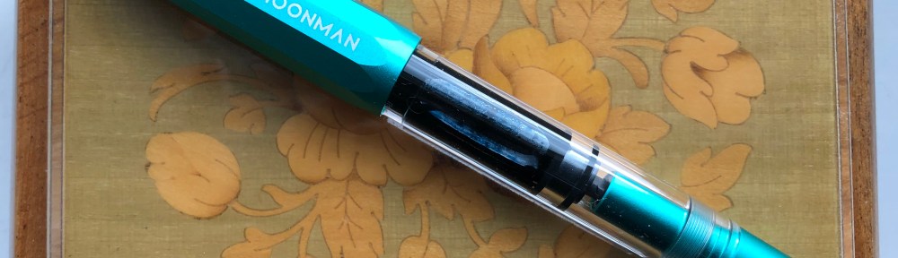 Fountain pen on box lid